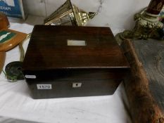 A rosewood travelling vanity box with fittings and bottles