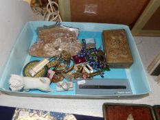 A box of miscellaneous items including Zippo lighter,