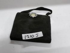 A ladies evening bag with watch clasp