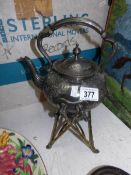 A silver plate spirit kettle complete with burner