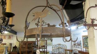 An early 19th century hand made circular kitchen rack
