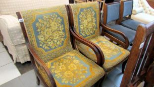 A pair of mahogany framed arm chairs