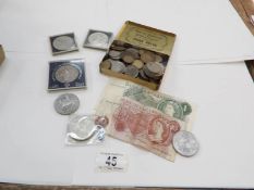 A mixed lot of coins together with a £1 and a 10/- bank note