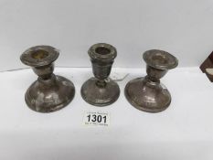 3 small silver candlesticks with weighted bottoms