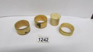 3 ivory napkin rings and an ivory dice pot with dice