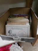 A box of cigarette cards in albums