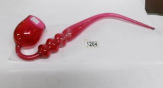 A Victorian ruby glass pipe,