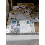 A box of first day covers and loose stamps