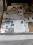 A box of first day covers and loose stamps