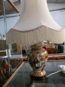 An oriental style table lamp with shade