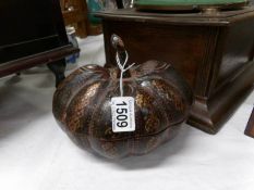 A carved wood and lacquered pumpkin shaped casket
