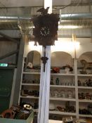 A Black Forest cuckoo clock with weights,