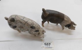 2 ceramic pig figures