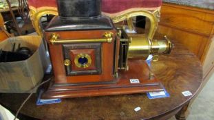 A superb quality Victorian magic lantern projector with wooden case