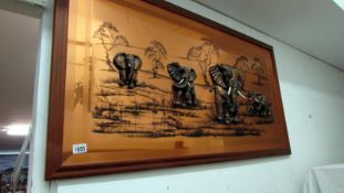 A copper relief picture of elephants