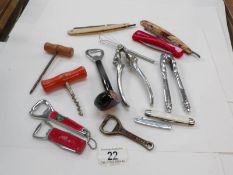 A mixed lot of pen knives, bottle openers,