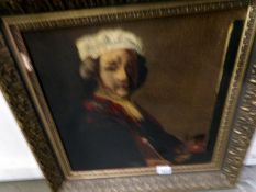 A gilt framed portrait of an elderly lady