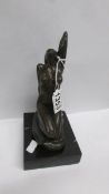 A bronze nude lady on marble base