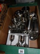 A large quantity of stainless tea and dinnerware,
