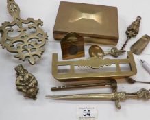 A mixed lot of brass including door knocker, trivet,