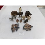 A collection of animal figures including Wood, metal, china and Wade