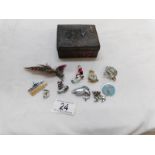 A mixed lot of pin badges in a Chinese spelter box