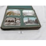 An Edwardian postcard album containing approximately 200 post cards