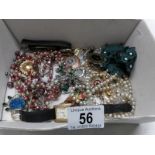 A mixes lot of costume jewellery including necklaces, brooches etc