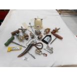 A mixed lot of old corkscrews, bottle corks etc