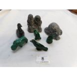 A mixed lot of carved figures and animals including Inuit