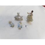 A Dresden figurine, 2 pin cushion ladies and one other figure