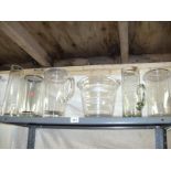 A shelf of glass vases etc