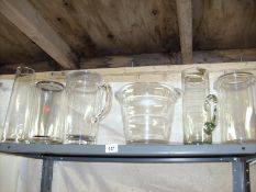 A shelf of glass vases etc