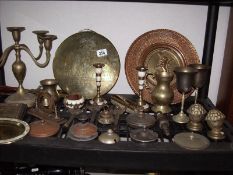 A shelf of brass ware