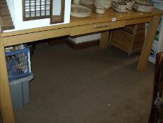 A large kitchen table with drawer