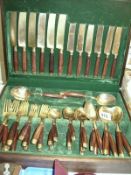 A gold plated cutlery set