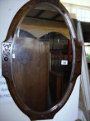 An oak bevelled wall mirror
