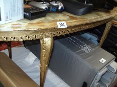 A marble top oval table