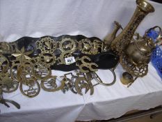 A quantity of horse brasses and other brass