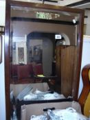 An oak framed bevel edged mirror