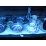 A shelf of blue and white china etc