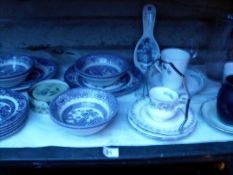 A shelf of blue and white china etc