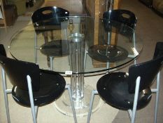 A retro glass top table and 4 chairs