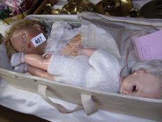 2 old dolls in carry case