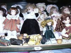 A shelf of collector's dolls