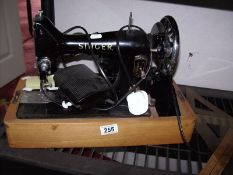 An old electric sewing machine and a typewriter