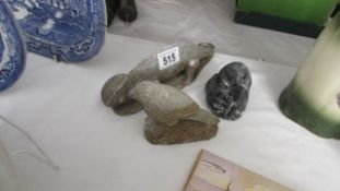 3 carved stone animals