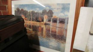 A framed and glazed Monet print