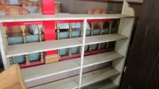 A set of painted pine wall shelves