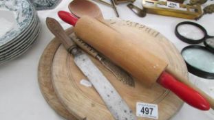 A quantity of bread boards, rolling pins etc